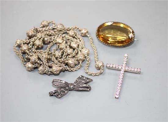 White metal jewellery to include a citrine? mounted brooch, a filigree work necklace, a marcasite set bow brooch & pendant.